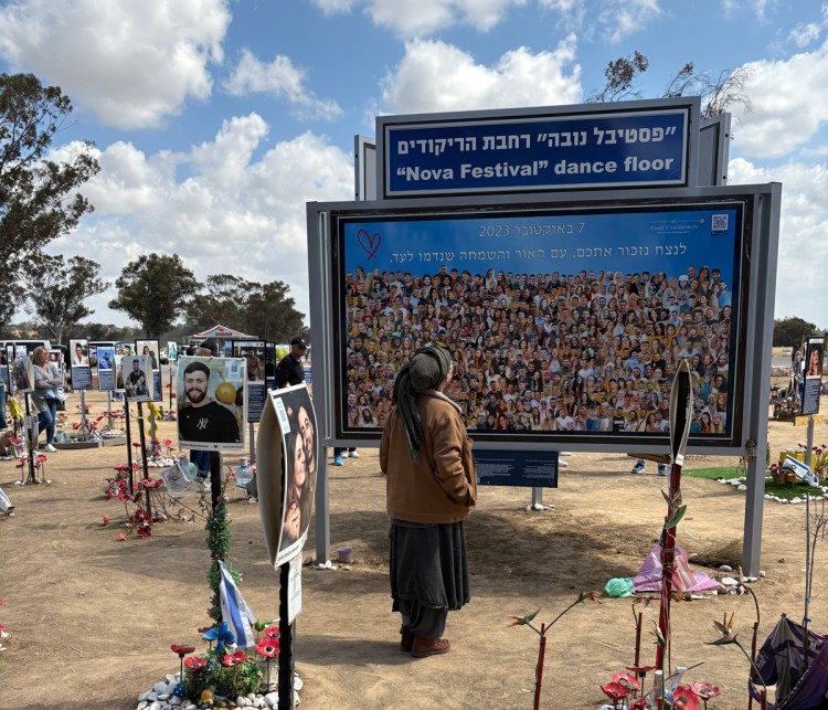 Mourners at an October 7 site